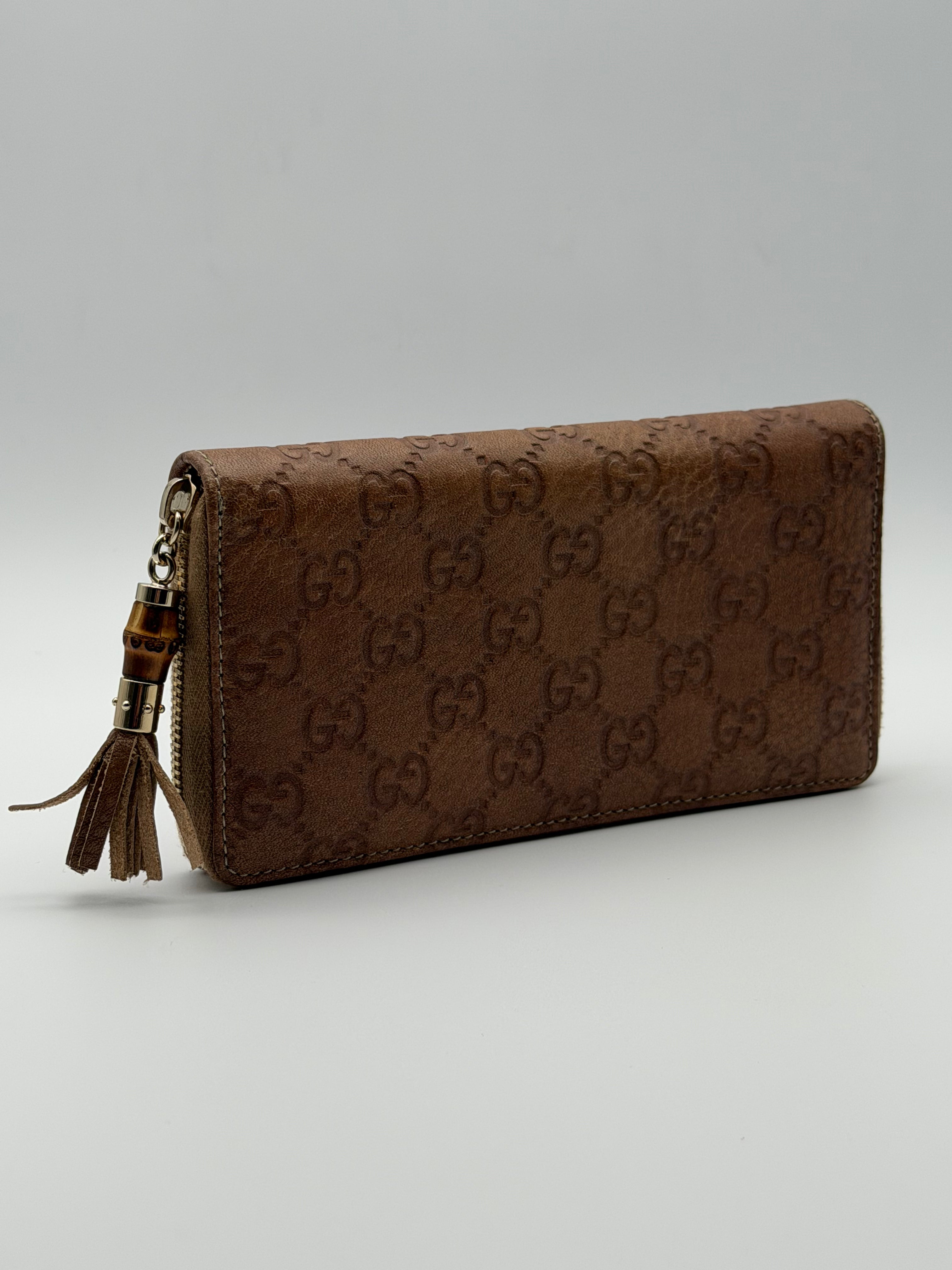 Gucci portafoglio in pelle Guccissima goffrata marrone chiaro e tiravamo in bambù - SGER S.r.l.