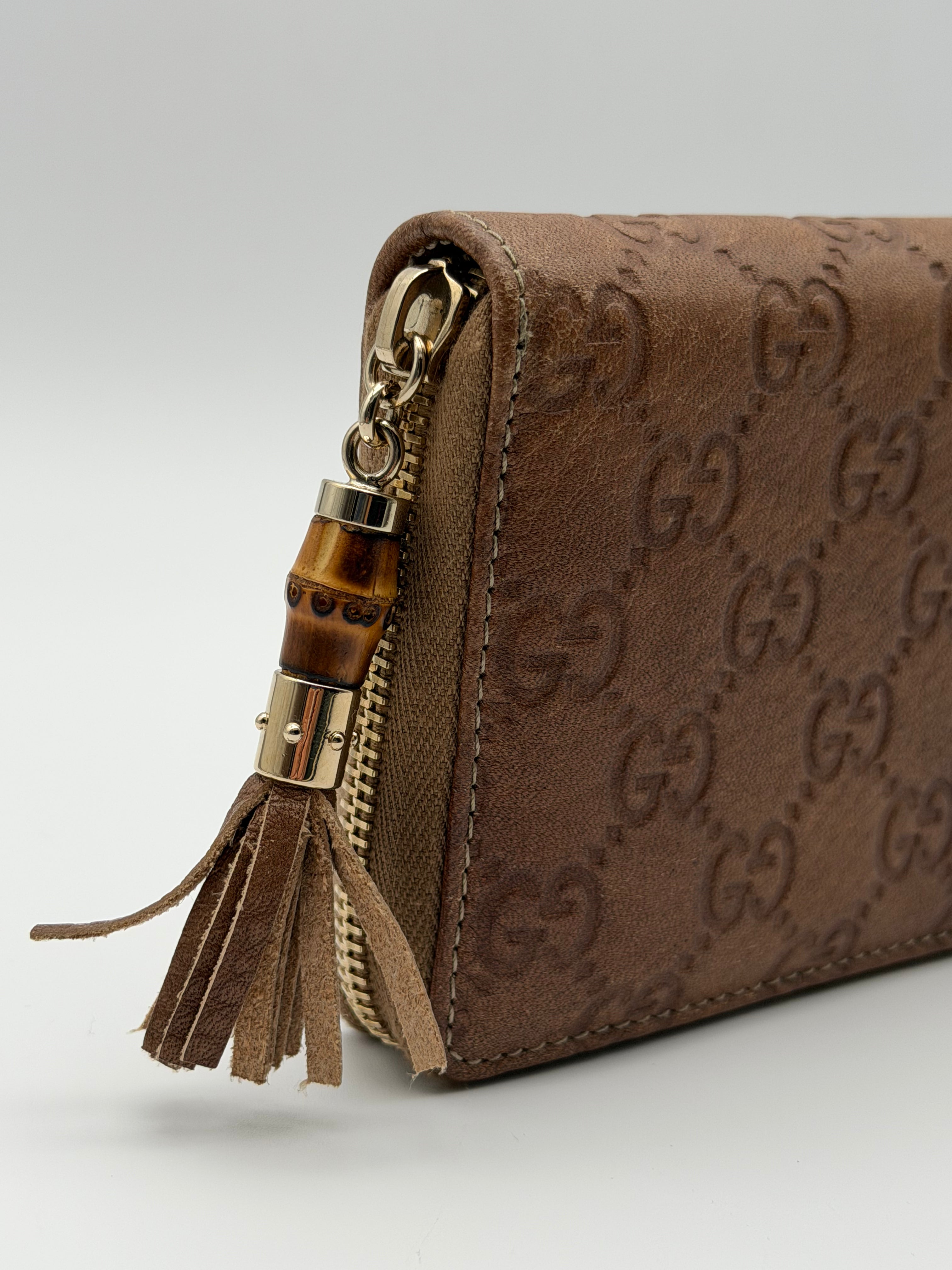 Gucci portafoglio in pelle Guccissima goffrata marrone chiaro e tiravamo in bambù - SGER S.r.l.