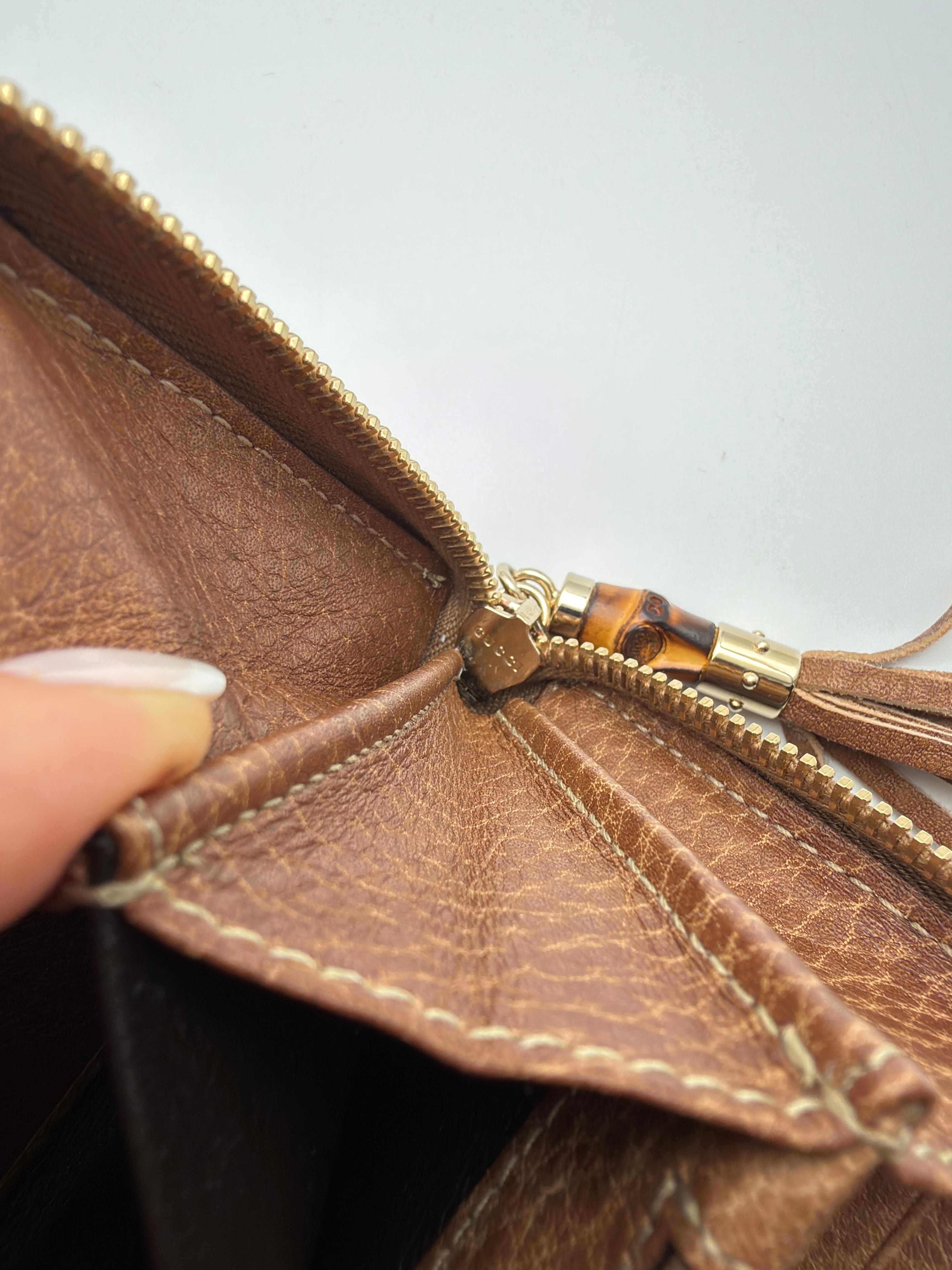 Gucci portafoglio in pelle Guccissima goffrata marrone chiaro e tiravamo in bambù