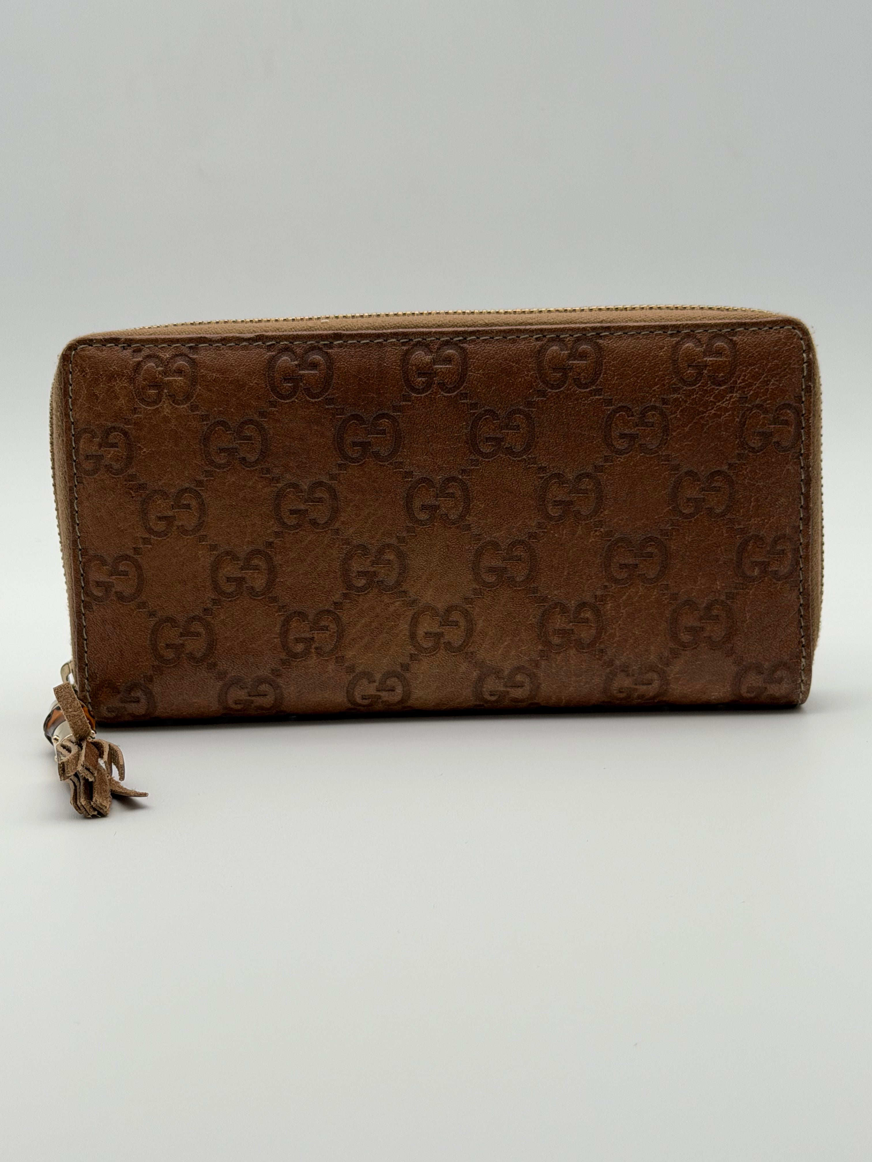 Gucci portafoglio in pelle Guccissima goffrata marrone chiaro e tiravamo in bambù - SGER S.r.l.
